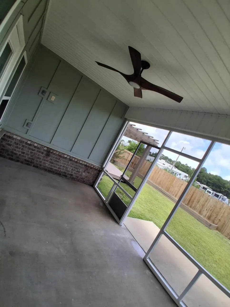 Screened porch with ceiling fan and board-and-batten walls